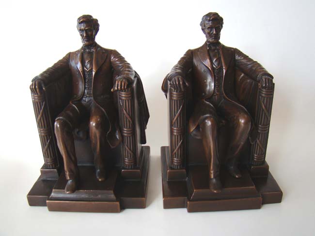 An exceptionally fine pair of Abraham Lincoln 'in the chair' bookends by Jennings Brothers of Meriden, CT, circa 1925